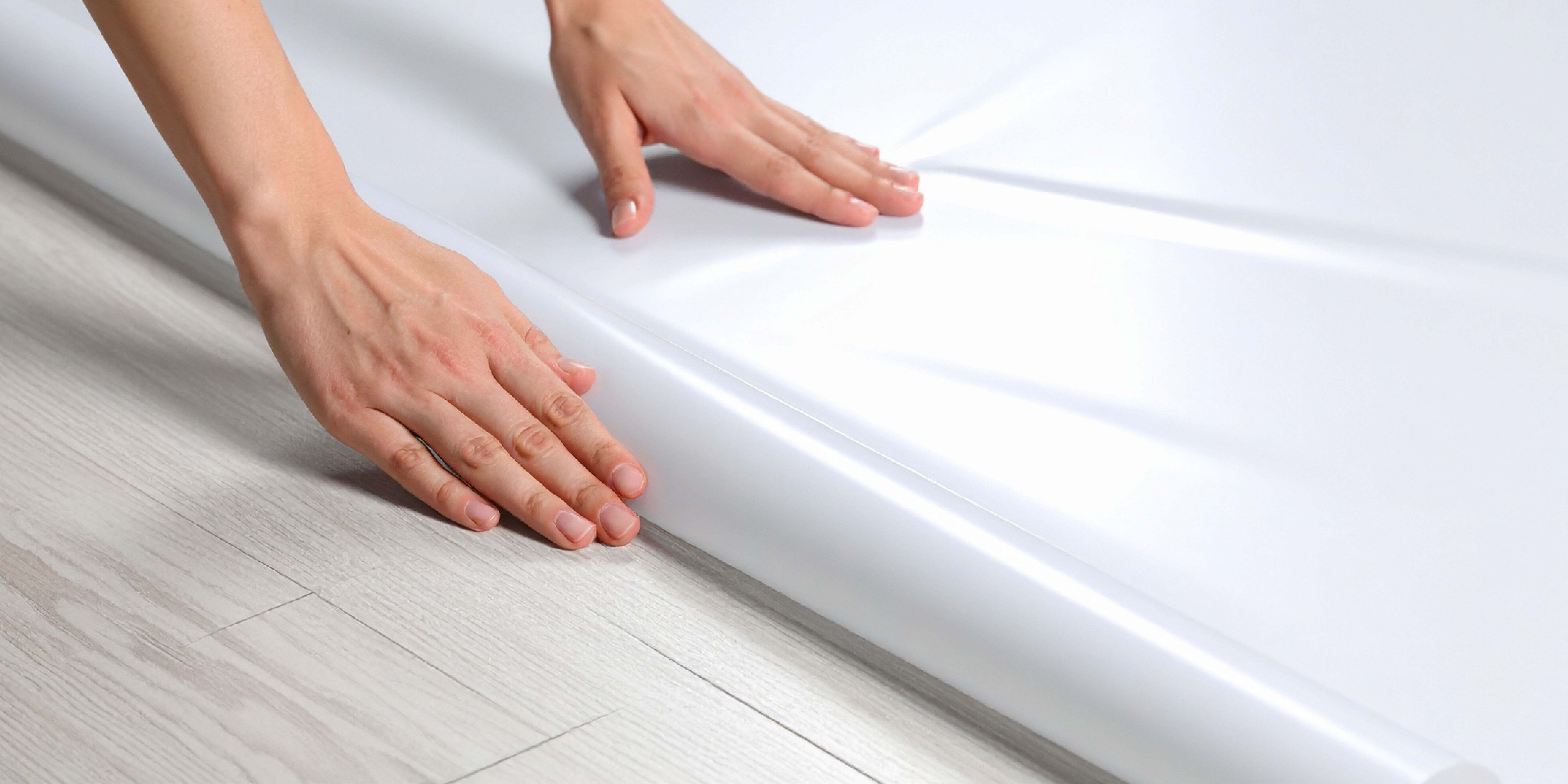 Lay the banner flat on a smooth surface